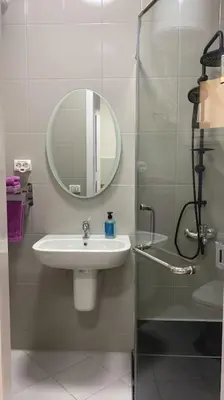 a bathroom with a sink and a mirror at Enjoy Makadi Heights Red Sea in Hurghada