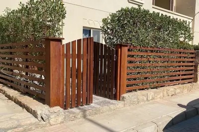 a wooden fence in front of a house at Enjoy Makadi Heights Red Sea in Hurghada