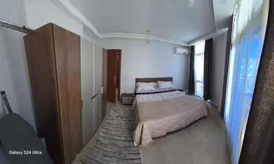 a bedroom with a bed and a large window at Sea view Princessa Resort in Hurghada