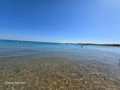 a group of people swimming in the water at Sea view Princessa Resort in Hurghada