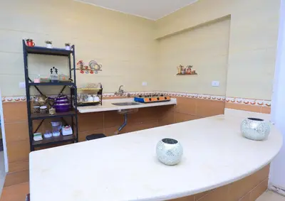 a room with a sink and two vases on a counter at Moka Gust House in Luxor