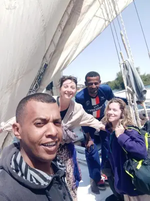 a group of people on a sail boat at Mama Africa Felucca in Aswan