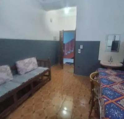 a living room with a bench and a sink at Ali Toot in Luxor