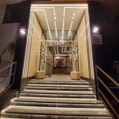 a staircase leading up to a building with lights at Hurghada Airport Aparthotel - SAHLHOMES in Hurghada