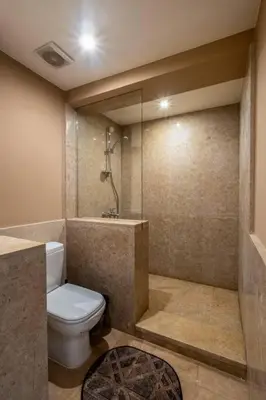a bathroom with a toilet and a shower at Ocean View: Spacious 2-Bed Apt in Hurghada