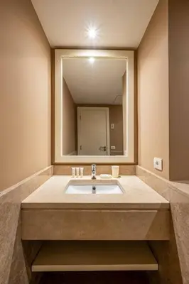 a bathroom with a sink with a large mirror at Ocean View: Spacious 2-Bed Apt in Hurghada