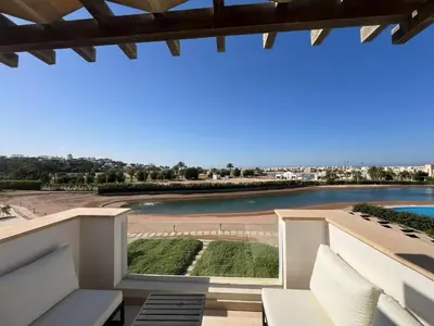 a view from the balcony of a resort with a river at Chic Cyan 3BR Apt. • Prime Location in Hurghada