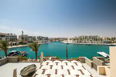 a view of a river with boats in a harbor at Freshly Minted: 1BR Fanadir Marina in Hurghada
