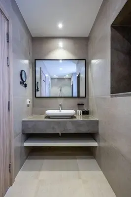 a bathroom with a sink and a large mirror at Freshly Minted: 1BR Fanadir Marina in Hurghada