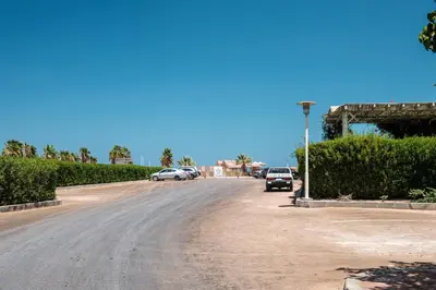 a street with cars parked on the side of a road at 2BR New Marina Retreat • Private Pool in Hurghada