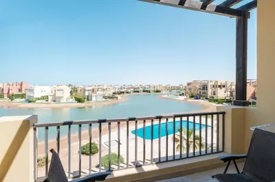 a balcony with a view of a river at Chic Tawila 1BR • Pristine & Modern in Hurghada