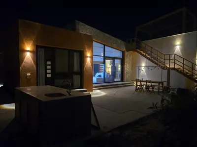 a house at night with a sink and a staircase at Somabay Beach House BW in Hurghada