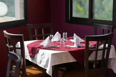 a table with a red and white table cloth on it at Grand Memphis Hotel in Luxor in Luxor