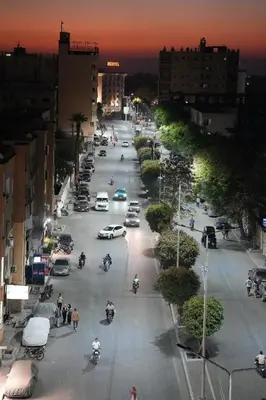 an aerial view of a city street with cars and motorcycles at Grand Memphis Hotel in Luxor in Luxor