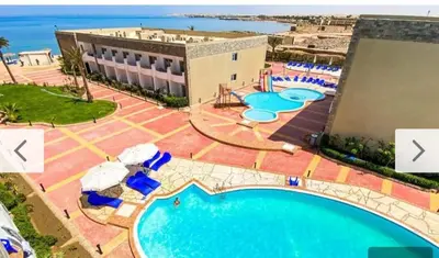 an overhead view of a pool at a resort at Cecelia Beach Resort - 2 Rooms with terace in Hurghada