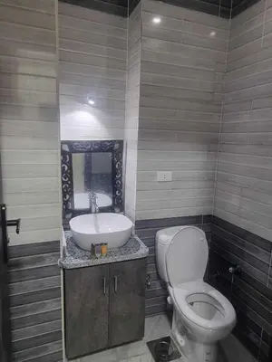 a bathroom with a toilet and a sink at Cecelia Beach Resort - 2 Rooms with terace in Hurghada