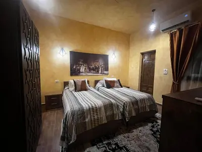 a bedroom with a bed in a room at Amenti House - Private Villa & Retreat Center in Luxor