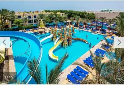 a large swimming pool with a water park at ميراج in Hurghada