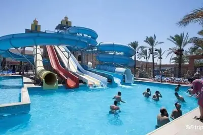 a group of people in the water at a water park at ميراج باي in Hurghada