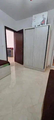 a large room with a sliding door and a television at Hurghada Al Hilal District in Hurghada