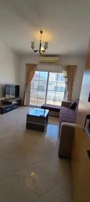 a living room with a couch and a table at Hurghada Al Hilal District in Hurghada