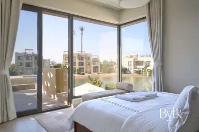a bedroom with a bed and a large window at BYTK - Villa La Calma in Hurghada