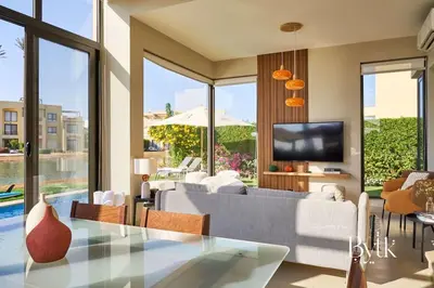 a living room with a couch and a tv at BYTK - Villa La Calma in Hurghada