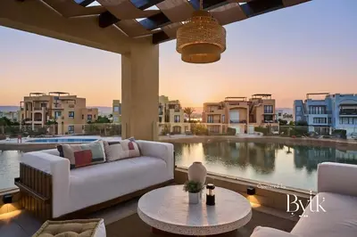 a living room with a couch and a view of a pool at BYTK - Villa La Calma in Hurghada