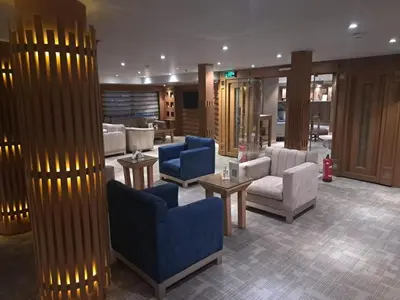 a lobby with couches and chairs and a fire hydrant at Five Stars Nile Cruise from Luxor to Aswan 4 nights in Aswan