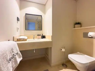a bathroom with a sink and a toilet at El Gouna at Birdnest in Hurghada