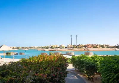 a view of a resort with bushes and water at El Gouna at Birdnest in Hurghada