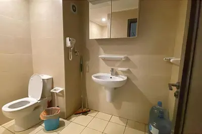a small bathroom with a toilet and a sink at Family apartment Aldau Heights in Hurghada