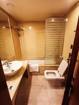 a bathroom with a toilet and a sink at Nile Cruise 3 nights From Aswan to Luxor in Aswan