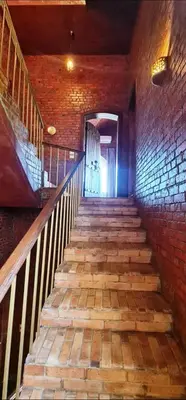 a set of stairs in a brick building at Luxor Tower in Luxor