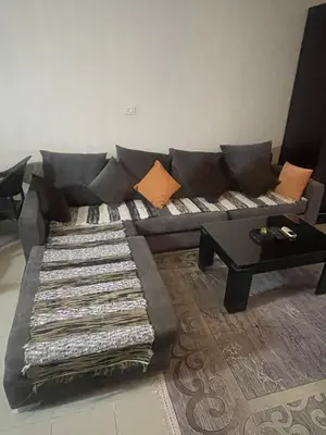 a living room with a couch and a table at The view in Hurghada