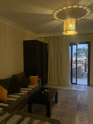 a living room with a couch and a table at The view in Hurghada