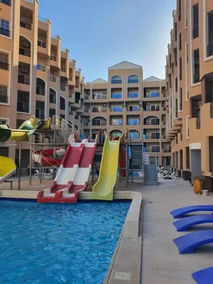 a pool with a slide and a water park at Juliana Beach Resort AG01 in Hurghada