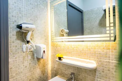 a bathroom with a sink and a mirror at Lazur Pool Apartment's - El Kawsar, Hurghada - Egypt in Hurghada