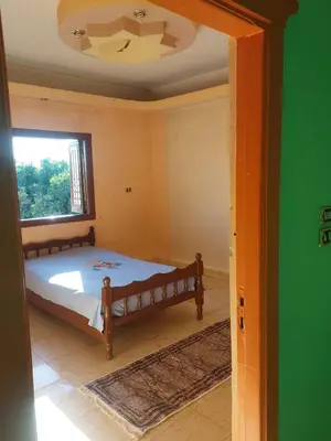 a bedroom with a bed and a window at The Best View With Great Location 2 Bedroom Apartment in Luxor in Luxor