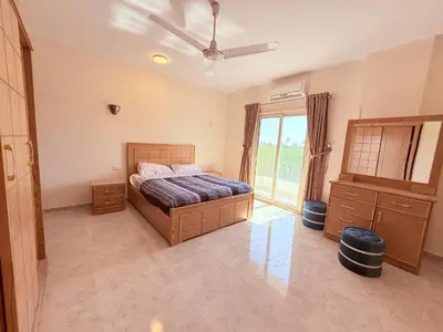 a bedroom with a bed and a window at Sheherazade Guesthouse in Luxor