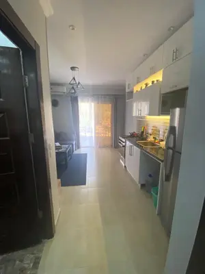 a large kitchen with a hallway and a living room at Hurghada Jungle Clube House Compound 1 bedroom Хургада компаунд студия в Джангл с 1 спальней in Hurghada