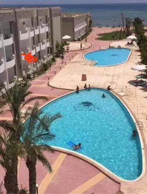 an overhead view of a large swimming pool at a resort at Cecilia resort hurghadaمنتجع سيسيليا in Hurghada