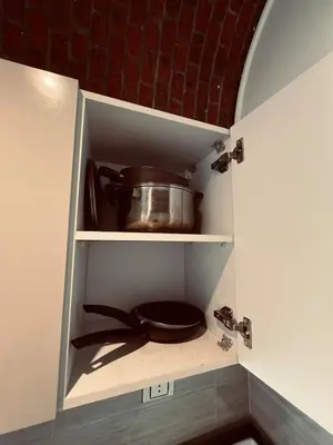 a cupboard with a pot and a lid in a kitchen at Rooftop in Hurghada with seaview and private terrace in Hurghada
