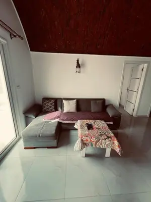 a living room with a bed and a couch at Rooftop in Hurghada with seaview and private terrace in Hurghada