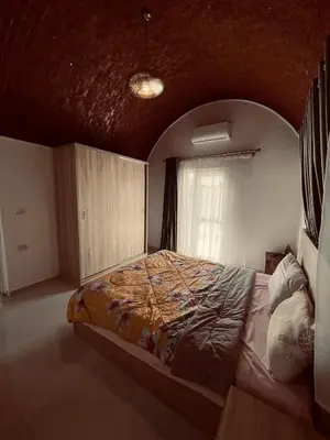 a bedroom with a bed in a room with a window at Rooftop in Hurghada with seaview and private terrace in Hurghada