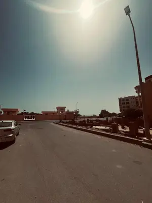 an empty street with a street light and a car at Rooftop in Hurghada with seaview and private terrace in Hurghada