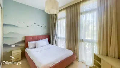 a bedroom with a bed and a large window at Ollystays Mangroovy 3BR Beach and Pool Free access in Hurghada