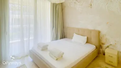 a bedroom with a bed with two pillows on it at Ollystays Mangroovy 3BR Beach and Pool Free access in Hurghada