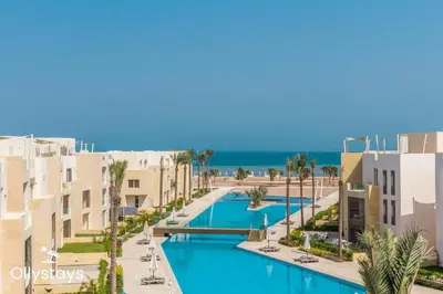 an aerial view of a resort with a swimming pool at Ollystays Mangroovy Seaview 2BR Beach and Pool Free access in Hurghada