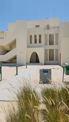 a view of a building with a courtyard at Ollystays Shedwan 1BR Pool & lagoon access in Hurghada